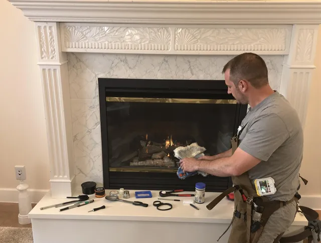 Lakewood Chimney Sweep performing fireplace maintenance in Lakewood, OH